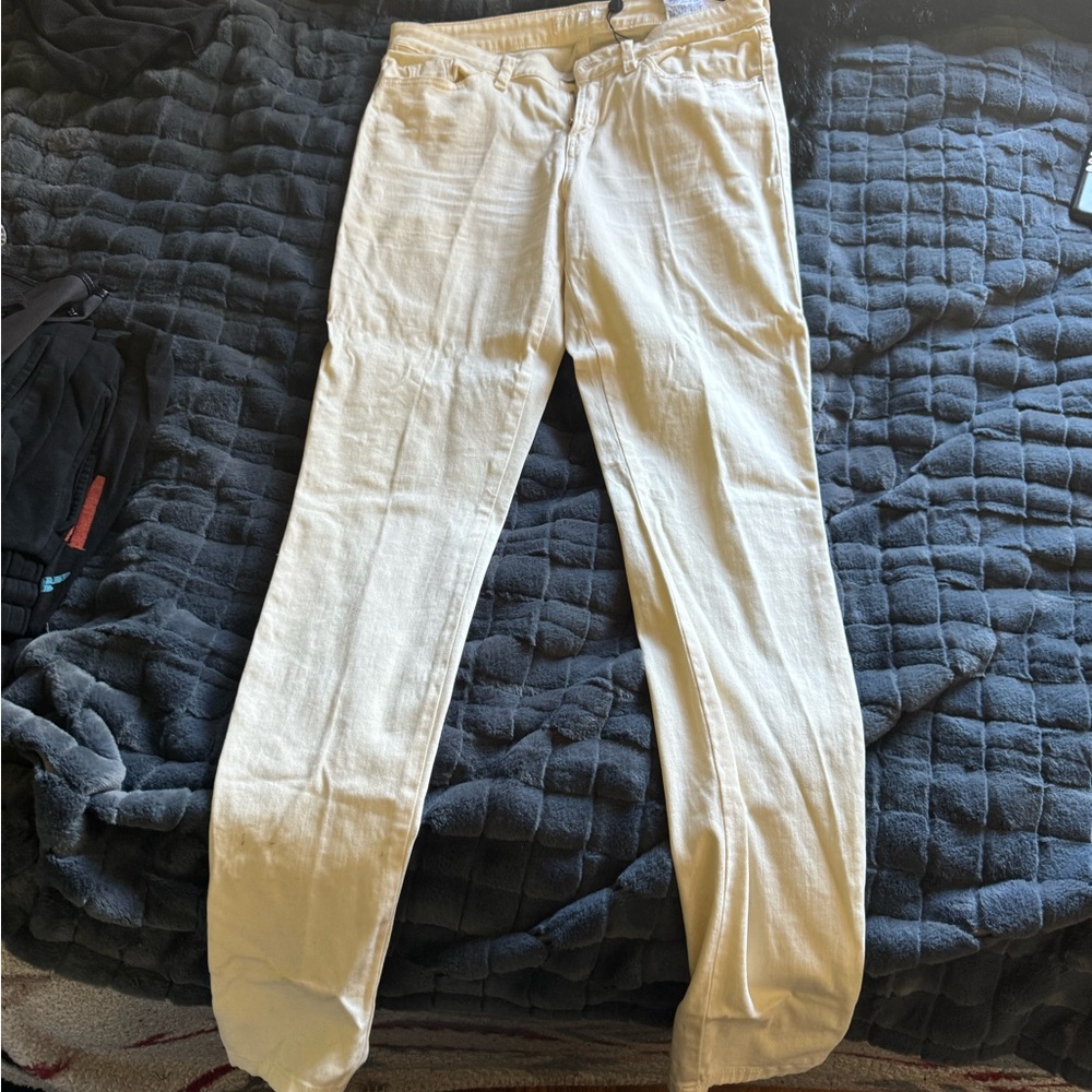 Yellow Cream colored Guess Jeans.